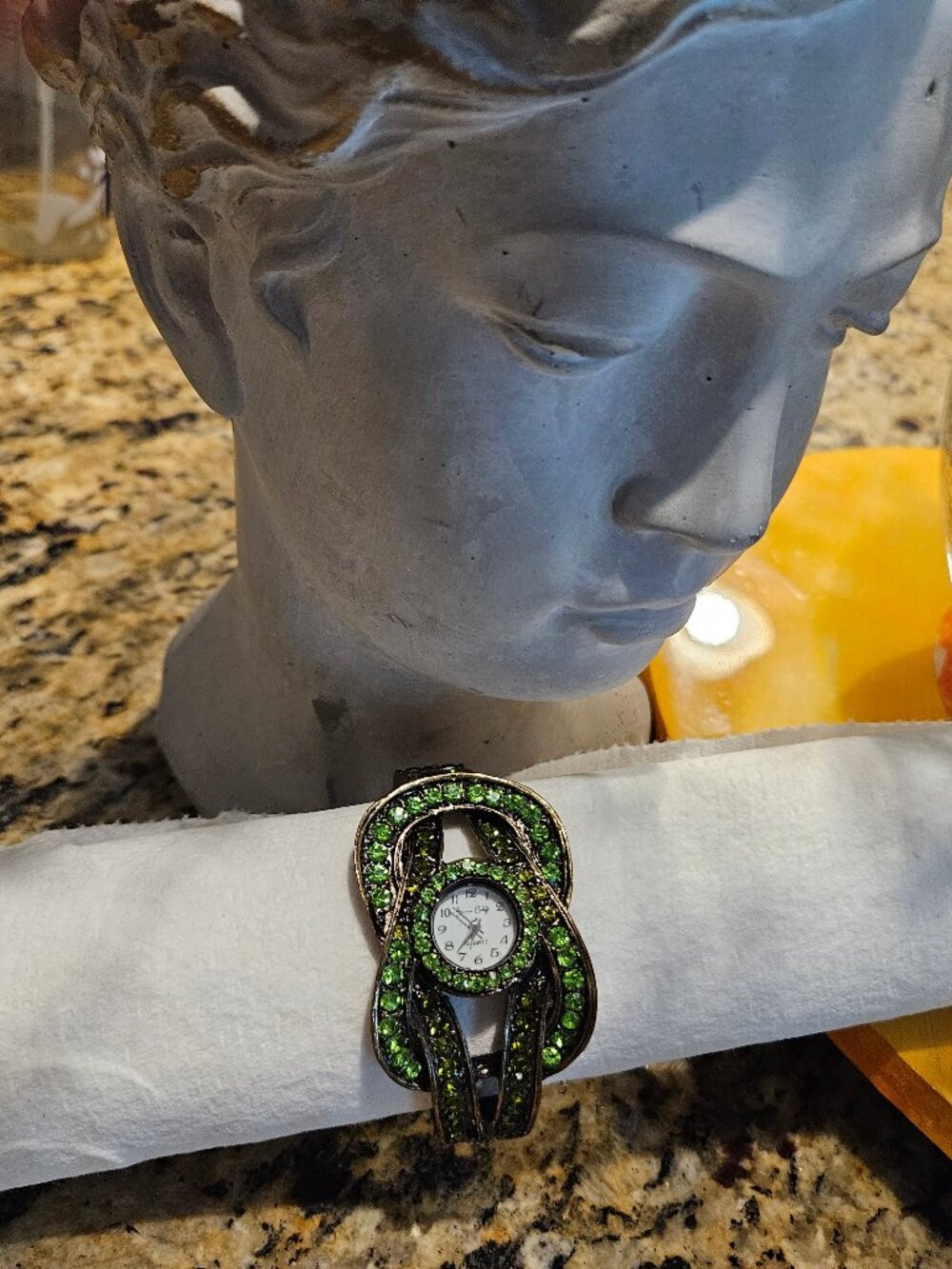 Beautiful hinged, Emerald style watch with new battery. Worned once to Wicked.